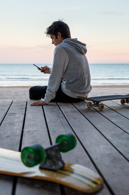 Young boy using his mobile phone