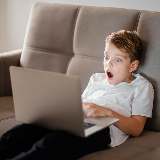 Young boy using laptop