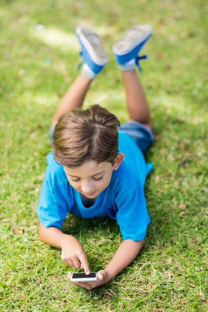 Young boy using mobile phone