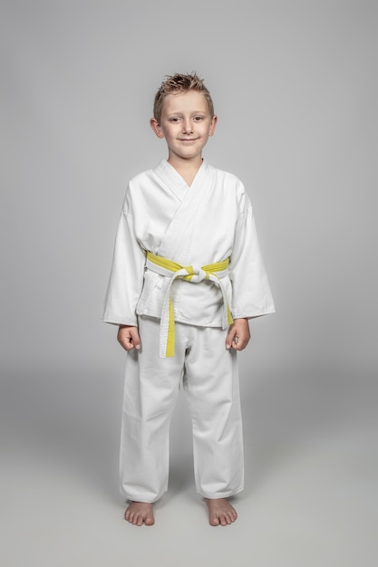 Young boy wearing martial arts costume