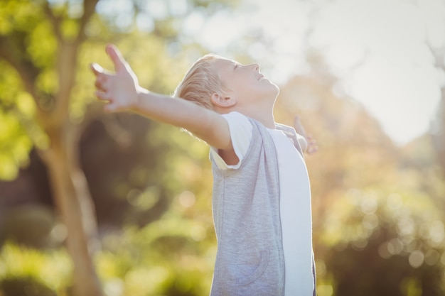 Young boy with arms outstretched