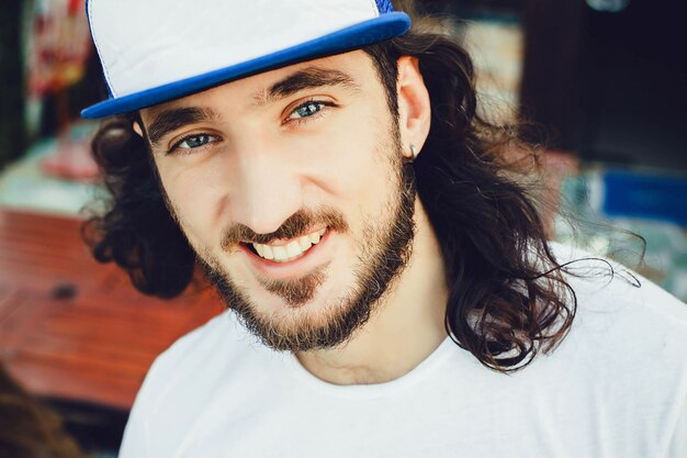 Young boy with cap smiling