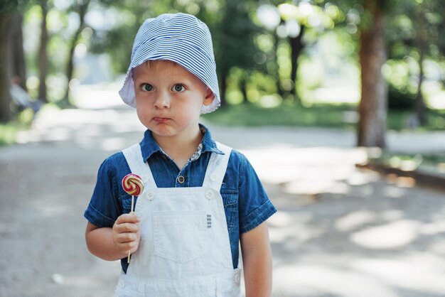 Young boy with colorful lollipop