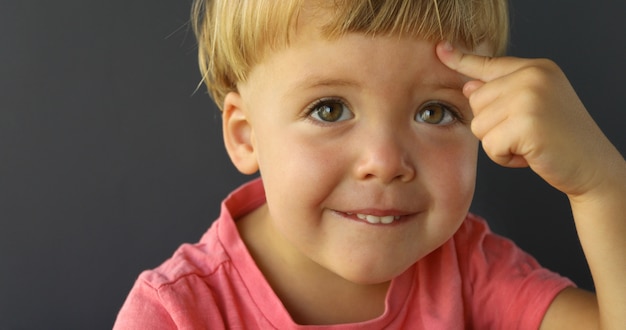 Young boy with an IDEA on his forehead