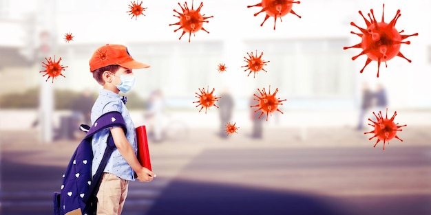 Young boy with protection mask against corona virus at school