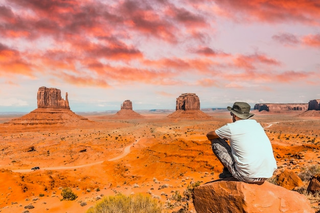a young boy with white t-shirt sitting in the monument valley national park in the visitor center