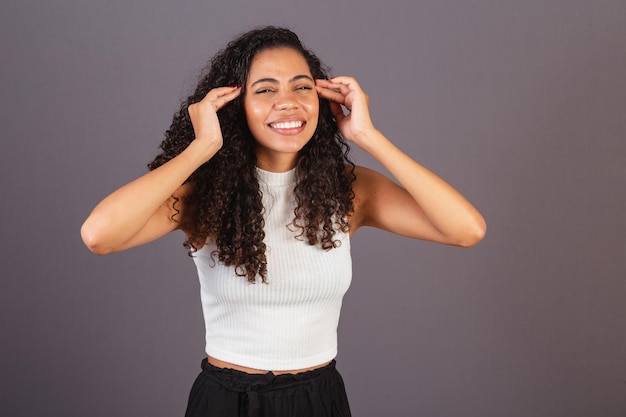 Young Brazilian black woman with headache