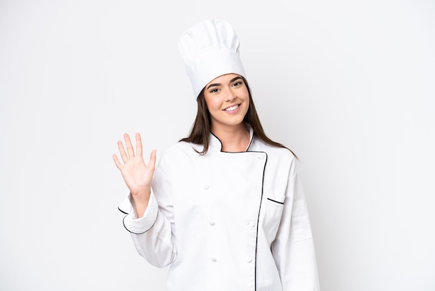 Young Brazilian chef woman isolated on white background counting five with fingers