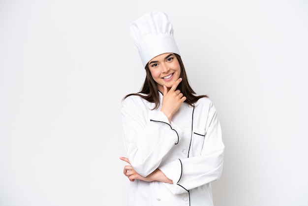 Young Brazilian chef woman isolated on white background smiling