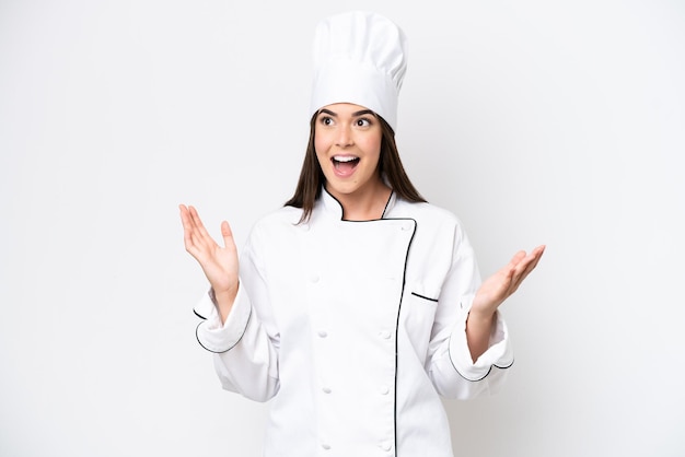 Young Brazilian chef woman isolated on white background with surprise facial expression