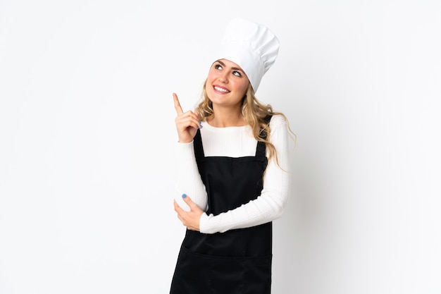 Young Brazilian chef woman isolated on white pointing up a great idea