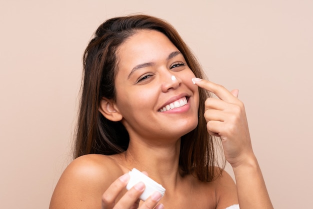 Young Brazilian girl with moisturizer