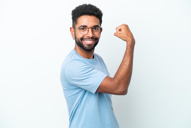 Young Brazilian man isolated on white background doing strong gesture