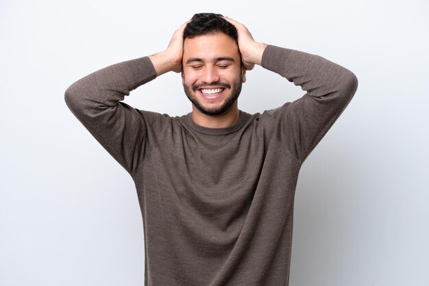 Young Brazilian man isolated on white background laughing