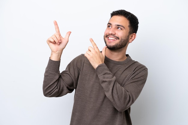 Young Brazilian man isolated on white background pointing with the index finger a great idea