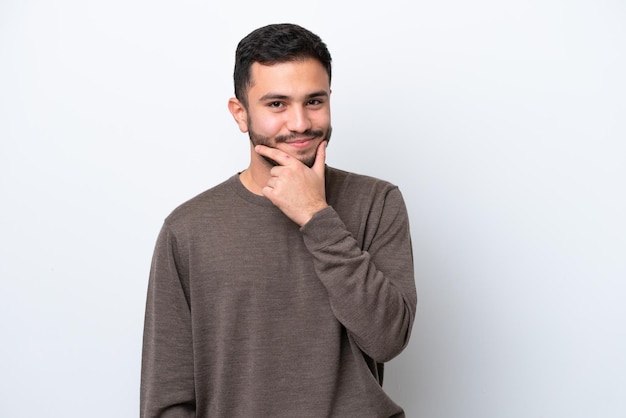 Young Brazilian man isolated on white background thinking