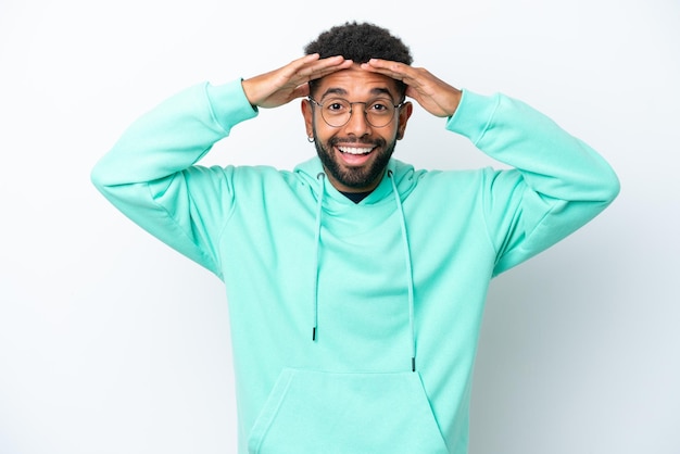 Young Brazilian man isolated on white background with surprise expression