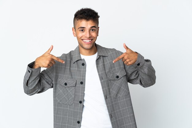 Young brazilian man isolated on white proud and self-satisfied