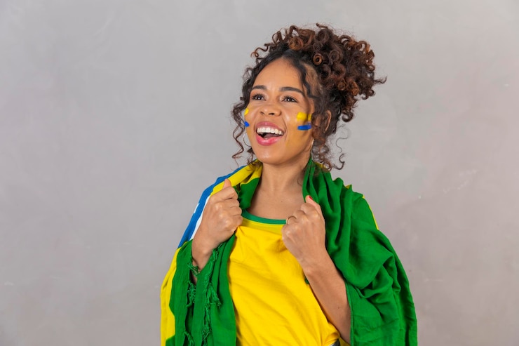 Photo 振動ブラジル サッカー チームを祝う若いブラジル サッカー ファン女性