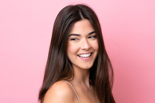 Young Brazilian woman isolated on pink background Portrait