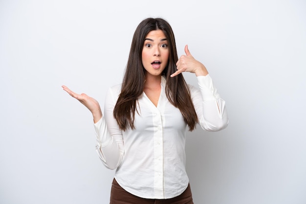 Young Brazilian woman isolated on white background making phone gesture and doubting