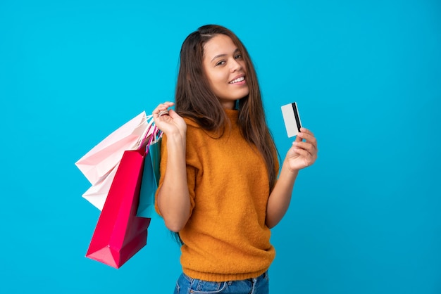 Young Brazilian woman with shopping bags