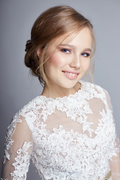 Young bride in a luxurious white wedding dress 