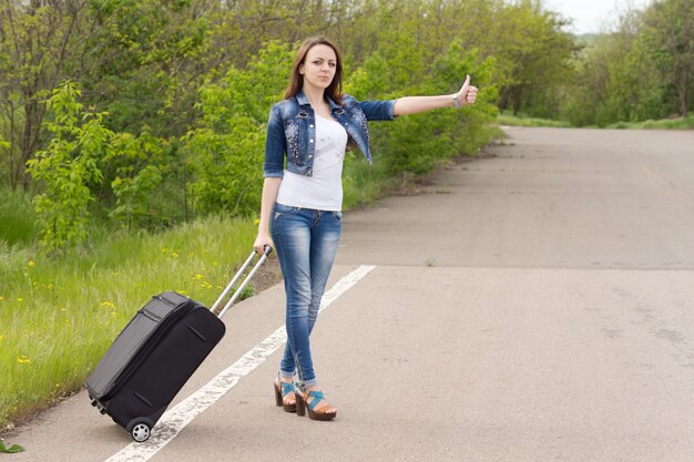 Young brunette attractive Caucasian woman wearing blue jeans