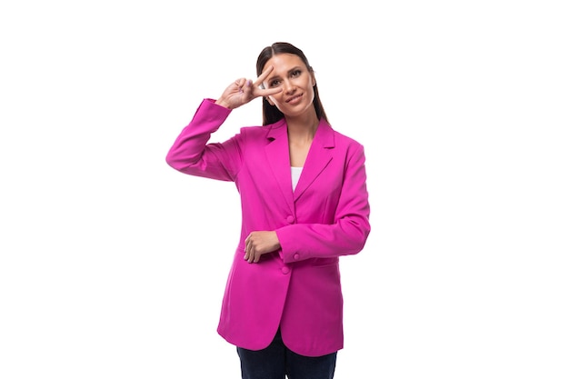 Young brunette business woman dressed in a lilac suit on a white background with copy space