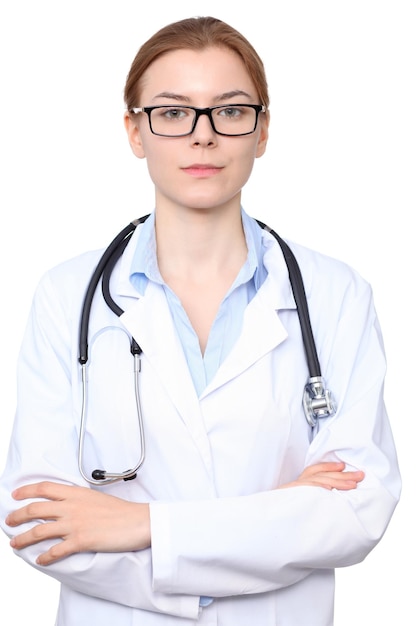 Young brunette female doctor standing with arms crossed. Isolated over white background.