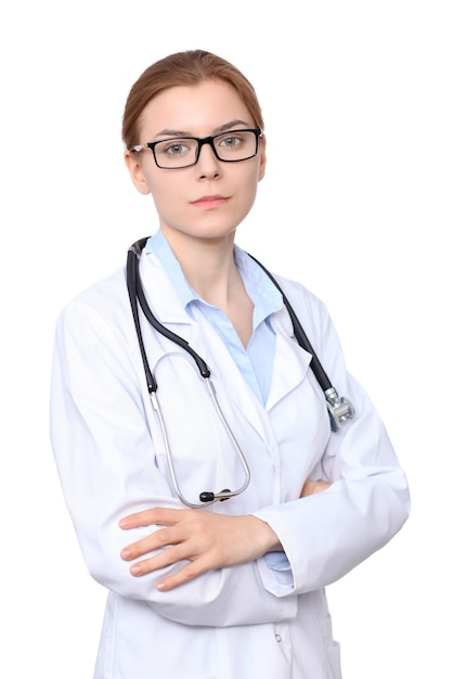 Young brunette female doctor standing with arms crossed. Isolated over white background.