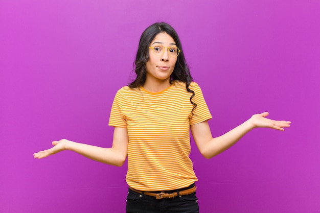 young brunette girl feeling puzzled and confused