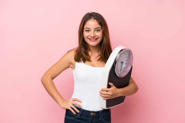 Young brunette girl over isolated