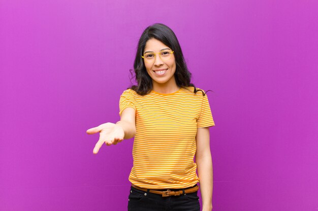 young brunette girl offering a handshake to close a deal