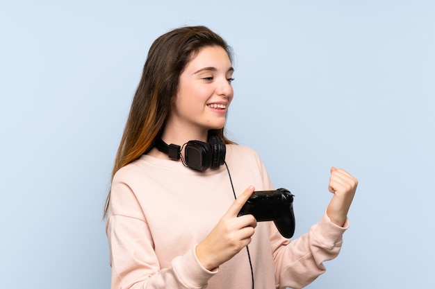 Young brunette girl playing at videogames