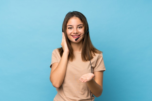 Young brunette girl working with headset