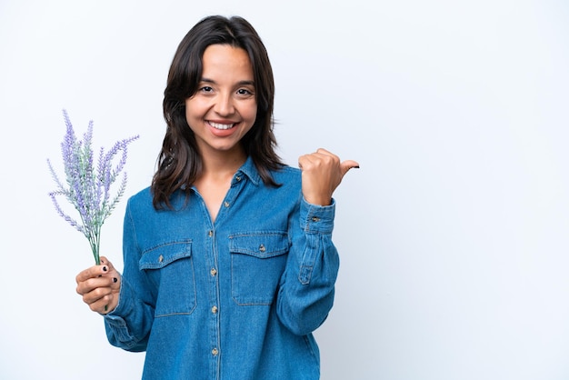 Young brunette hispanic woman on isolated background