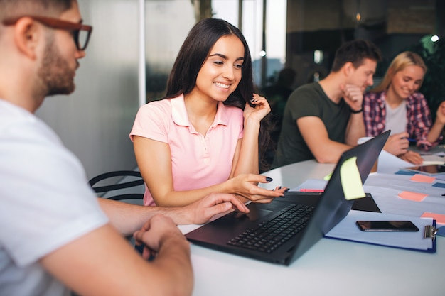 young brunette look at laptop