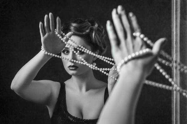 Young brunette model woman with pearl beads