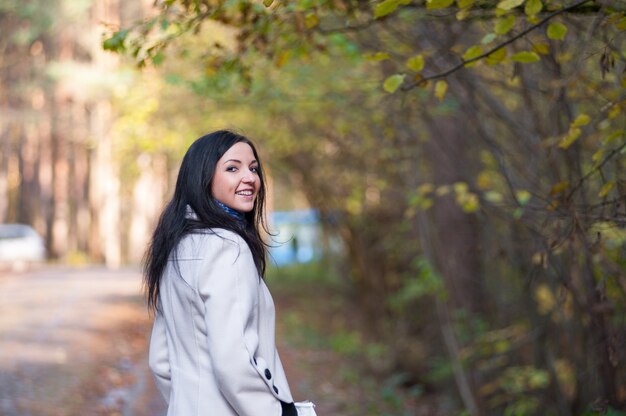 Young brunette in a white jacket. s