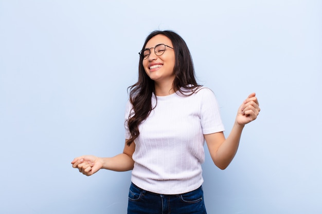 young brunette woman happy dancing