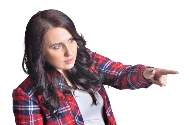 Young brunette woman making facial expression against white