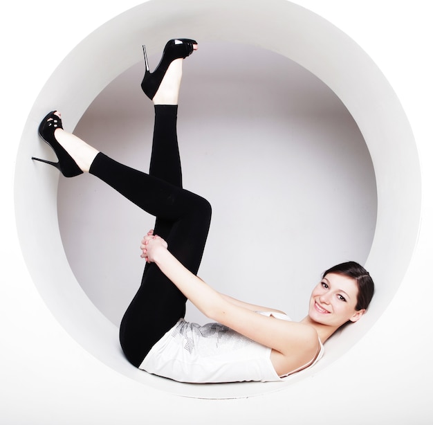 Young brunette woman posing  in a circle