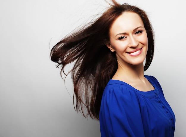 Young brunette woman in shirt