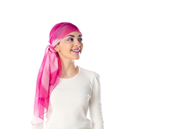 Young brunette woman wearing pink head scarf isolated