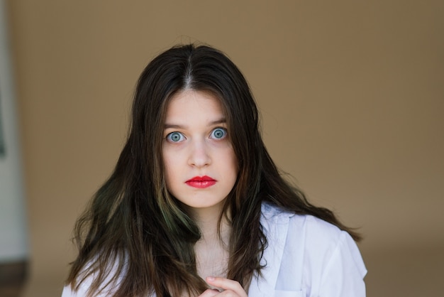 Young brunette woman with blue eyes