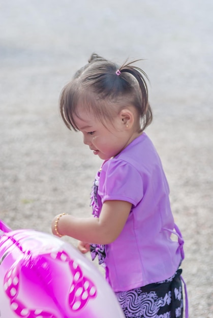 Young Burmese child is having fun at the Kathina meritmaking festival