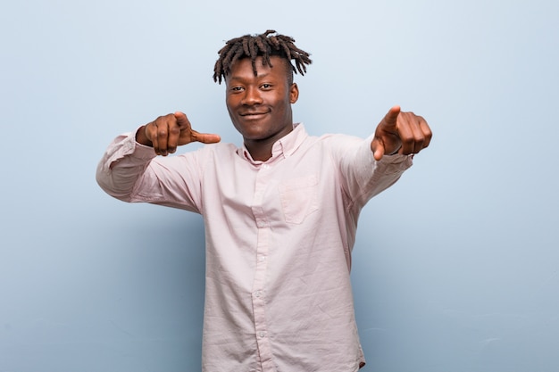 Young business african black man cheerful smiles pointing to front.