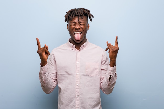 Young business african black man showing rock gesture with fingers