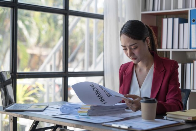 young business asian women are stressed while working on laptop tired asian businesswoman with headache at office feeling sick at work copy space in workplace an home office